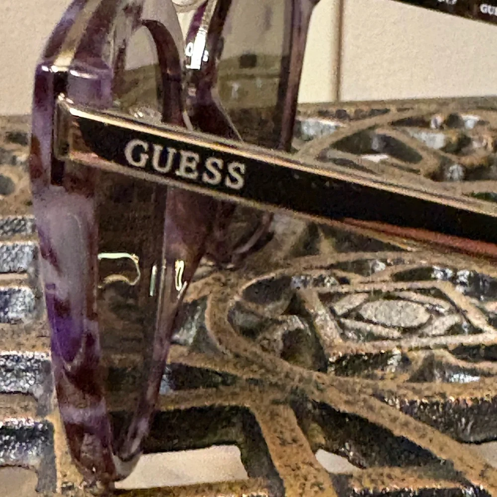 Guess Purple Marble Sunglasses with Blue Mirrored Lenses